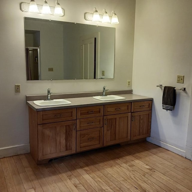41 Coombs Hill Rd, Shelburne, MA 01340 - bathroom with wood-type flooring, baseboards, and double vanity