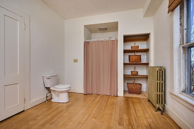 41 Coombs Hill Rd, Shelburne, MA 01340 - full bath featuring radiator heating unit, hardwood / wood-style floors, toilet, and healthy amount of natural light