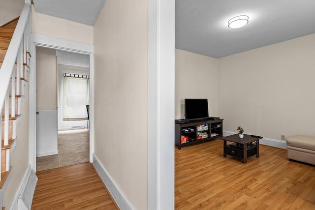 29 Sampson St Unit 29, Grafton, MA 01560 - living area featuring light wood finished floors, stairway, and baseboards