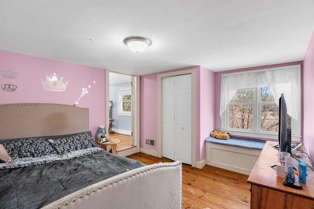 231 W Main St, Georgetown, MA 01833 - bedroom featuring light wood-style flooring, baseboards, and a closet