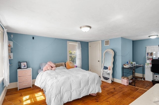 231 W Main St, Georgetown, MA 01833 - bedroom featuring wood finished floors and baseboards