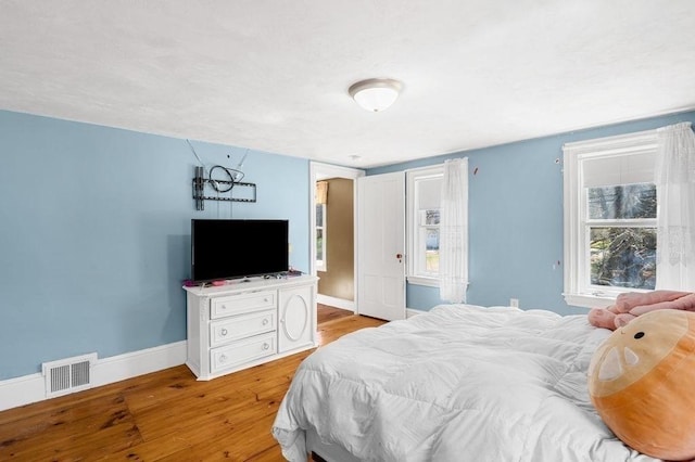 231 W Main St, Georgetown, MA 01833 - bedroom with light wood finished floors and baseboards