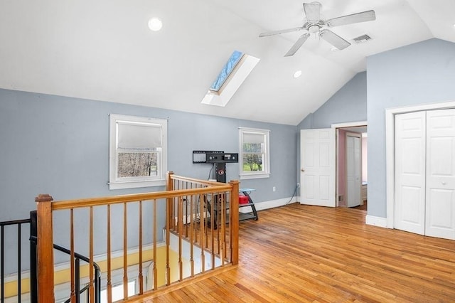 231 W Main St, Georgetown, MA 01833 - bonus room featuring vaulted ceiling, wood finished floors, a skylight, ceiling fan, and baseboards