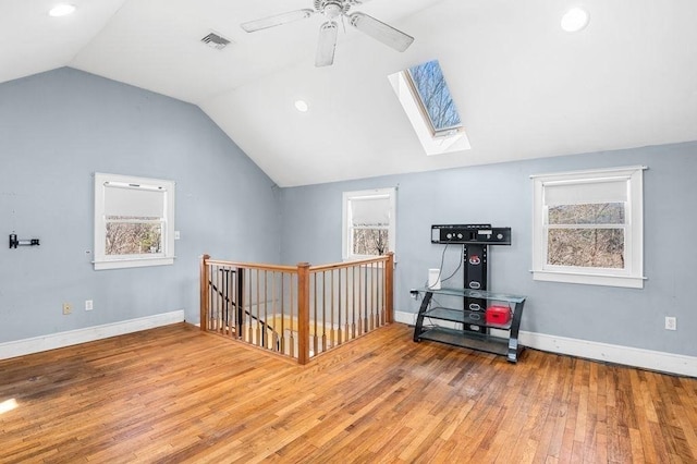 231 W Main St, Georgetown, MA 01833 - bonus room with vaulted ceiling, a skylight, wood finished floors, a ceiling fan, and baseboards