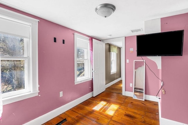 231 W Main St, Georgetown, MA 01833 - unfurnished bedroom with wood-type flooring and baseboards