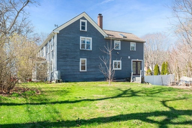 231 W Main St, Georgetown, MA 01833 - rear view of property with a chimney