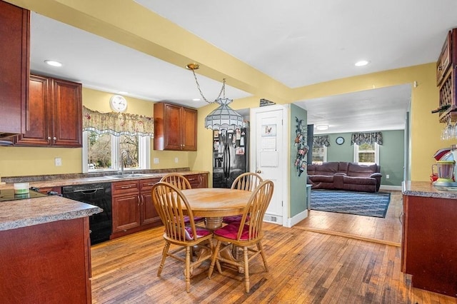 231 W Main St, Georgetown, MA 01833 - kitchen with black appliances, a sink, light wood-type flooring, recessed lighting, and open floor plan