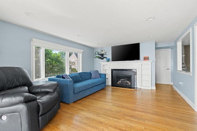 70 Williams St, Quincy, MA 02171 - living area with light wood-type flooring, a fireplace, and recessed lighting