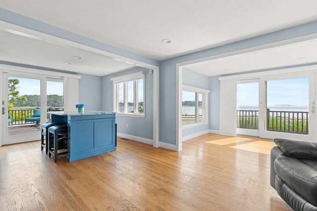 70 Williams St, Quincy, MA 02171 - living area with baseboards and light wood-type flooring