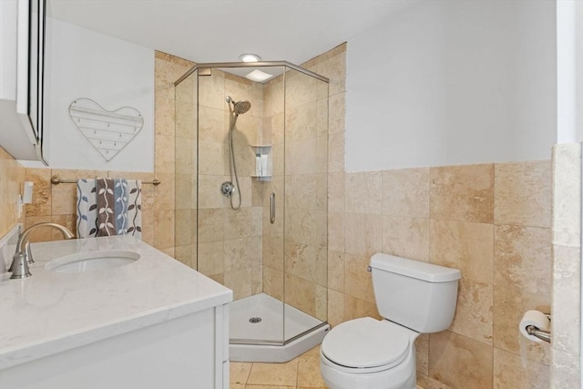 70 Williams St, Quincy, MA 02171 - bathroom with tile walls, vanity, a shower stall, and a wainscoted wall