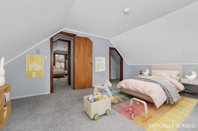 carpeted bedroom featuring vaulted ceiling and baseboards