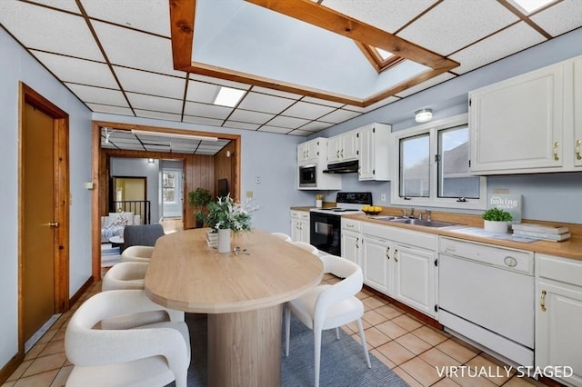 kitchen featuring electric stove, dishwasher, under cabinet range hood, white cabinetry, and a sink