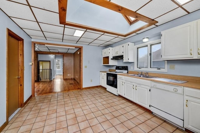 kitchen with electric range, dishwasher, under cabinet range hood, white cabinetry, and a sink