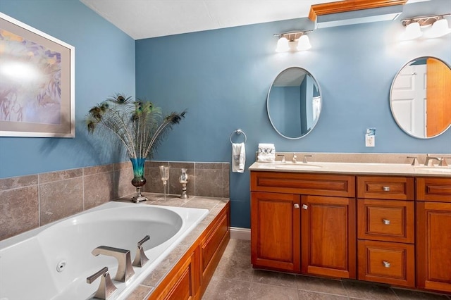 full bath with double vanity, tile patterned flooring, a jetted tub, and a sink