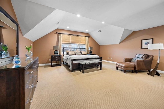 bedroom with vaulted ceiling, baseboards, and light carpet