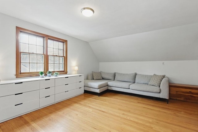 sitting room featuring lofted ceiling and light wood-style floors