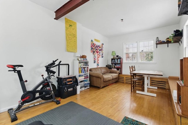 workout area with wood-type flooring