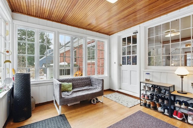 sunroom / solarium featuring wood ceiling and a wealth of natural light