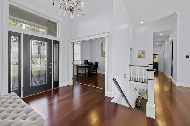 8 Garden St, Woburn, MA 01801 - foyer entrance with wood finished floors, ornamental molding, a high ceiling, baseboards, and a chandelier