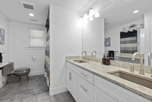 8 Garden St, Woburn, MA 01801 - bathroom featuring toilet, baseboards, double vanity, curtained shower, and recessed lighting
