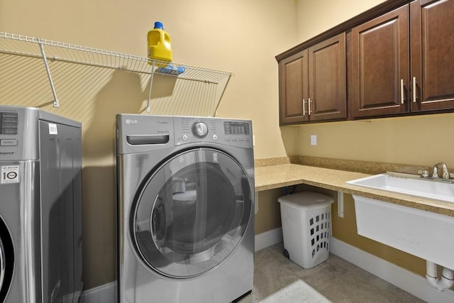 8 Garden St, Woburn, MA 01801 - laundry room featuring separate washer and dryer and cabinet space