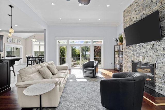 8 Garden St, Woburn, MA 01801 - living area with a stone fireplace, healthy amount of natural light, wood finished floors, crown molding, and recessed lighting