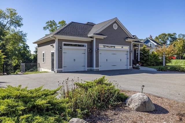 8 Garden St, Woburn, MA 01801 - view of front of property featuring a garage, driveway, and roof with shingles