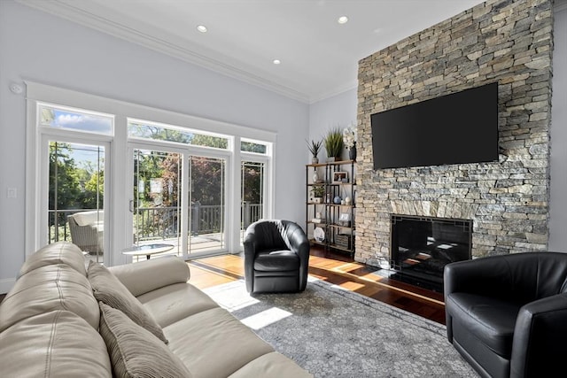 8 Garden St, Woburn, MA 01801 - living room featuring wood finished floors, ornamental molding, healthy amount of natural light, a fireplace, and recessed lighting