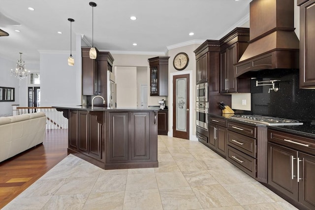 8 Garden St, Woburn, MA 01801 - kitchen with custom range hood, stainless steel appliances, dark brown cabinets, crown molding, and a chandelier