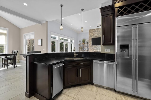 8 Garden St, Woburn, MA 01801 - kitchen with stainless steel appliances, a sink, plenty of natural light, a peninsula, and recessed lighting