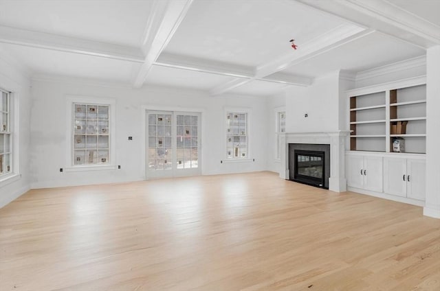 unfurnished living room featuring beam ceiling, ornamental molding, coffered ceiling, and light wood-type flooring