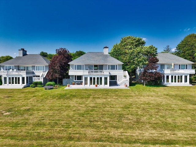 26 N Shore Dr Unit 7, Dartmouth, MA 02748 - back of house featuring a balcony, a patio, a yard, and a chimney