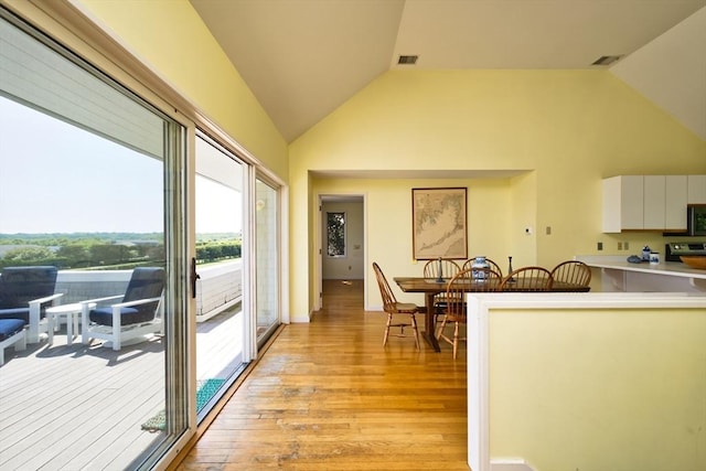 26 N Shore Dr Unit 7, Dartmouth, MA 02748 - kitchen featuring light wood-type flooring, white cabinets, light countertops, stainless steel microwave, and range