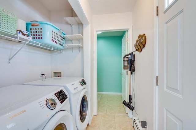 laundry room with washing machine and dryer and light tile patterned flooring