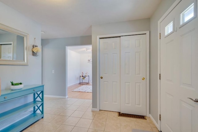 foyer featuring light tile patterned flooring