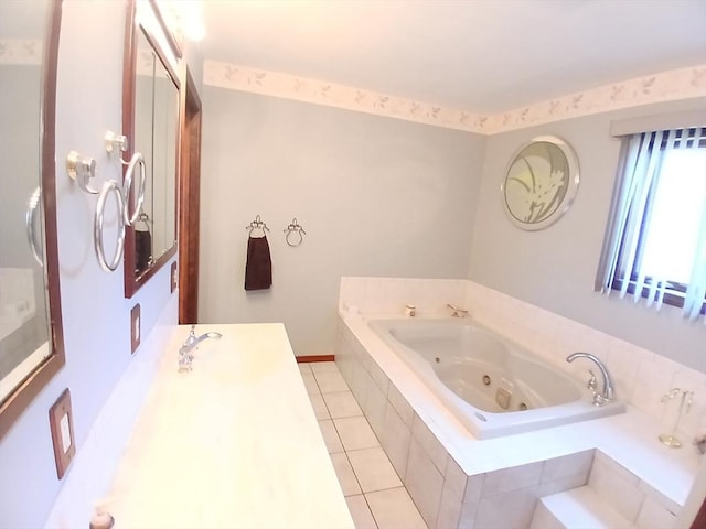full bathroom featuring vanity, tile patterned flooring, and a tub with jets