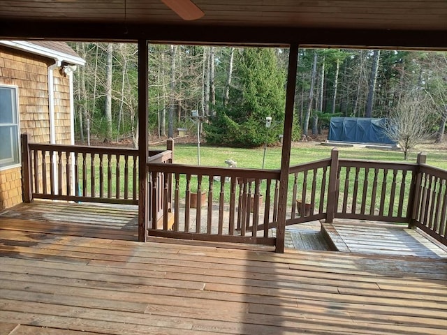 deck with a lawn, a ceiling fan, and area for grilling