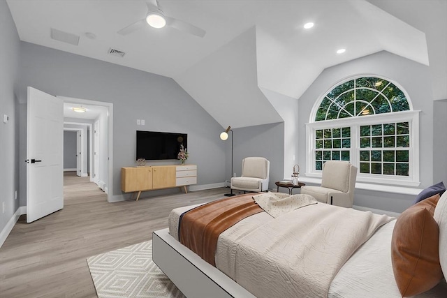 bedroom featuring vaulted ceiling, ceiling fan, and light wood-type flooring