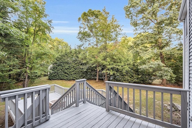 deck featuring a lawn