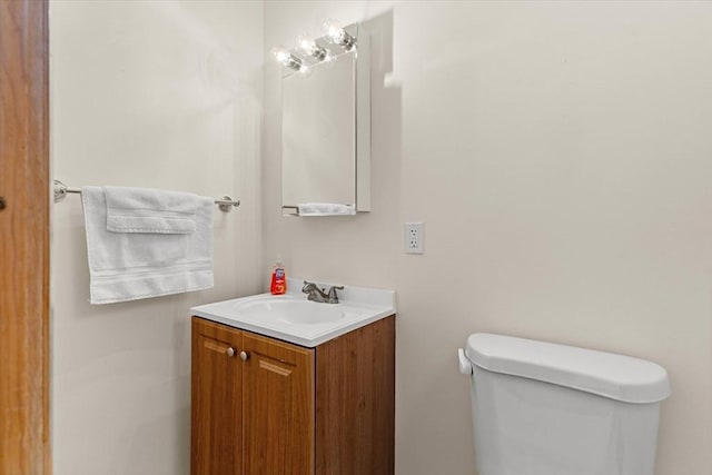 half bath with vanity and toilet