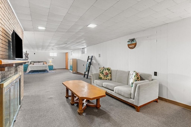 living room with carpet floors, a fireplace, and baseboards