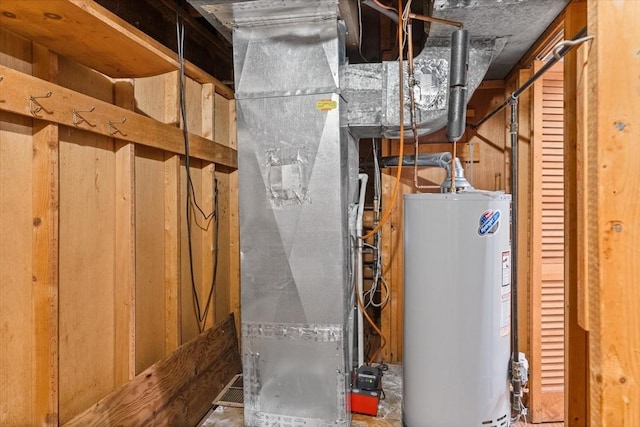 utility room featuring water heater