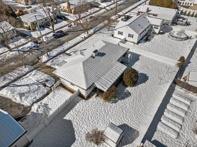 snowy aerial view featuring a residential view