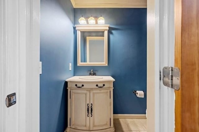 bathroom featuring vanity and crown molding