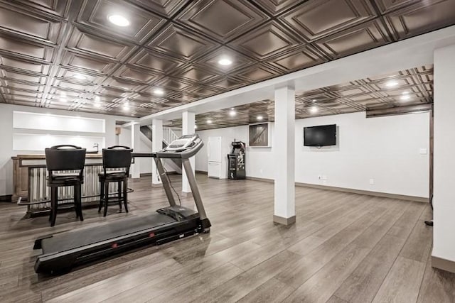 workout area featuring wood-type flooring