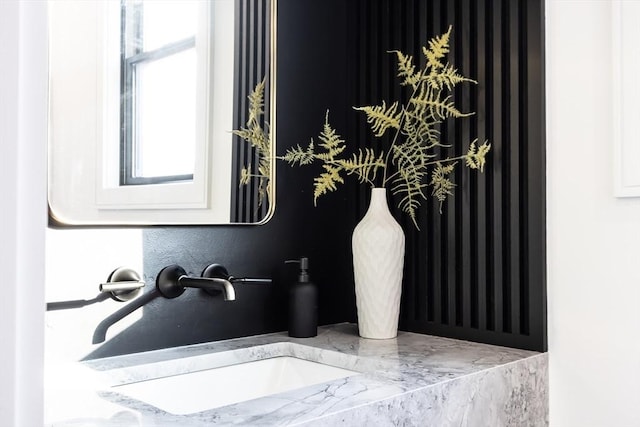 bathroom featuring plenty of natural light and a sink