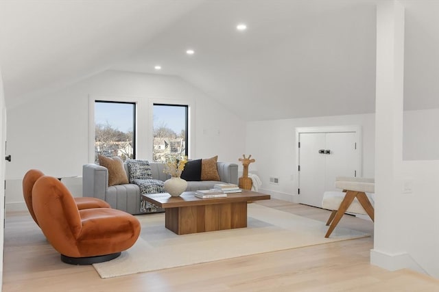 sitting room featuring lofted ceiling, visible vents, light wood-style flooring, and recessed lighting