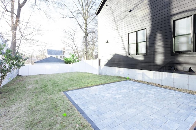 view of yard featuring a patio and a fenced backyard