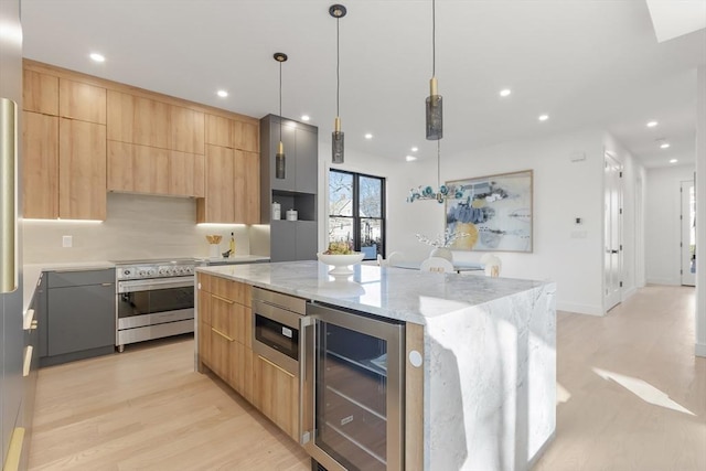 kitchen with beverage cooler, a large island, modern cabinets, stainless steel electric range, and light brown cabinetry