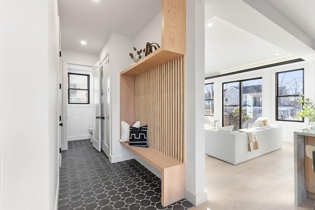 mudroom with recessed lighting and baseboards